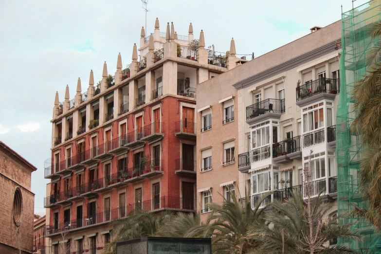 a building with large windows and many balconies