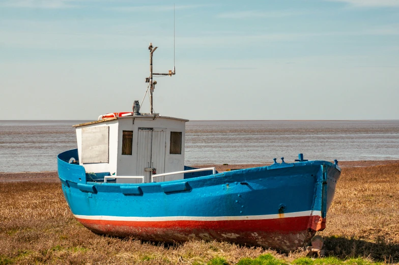 a large boat in the dry land on the water