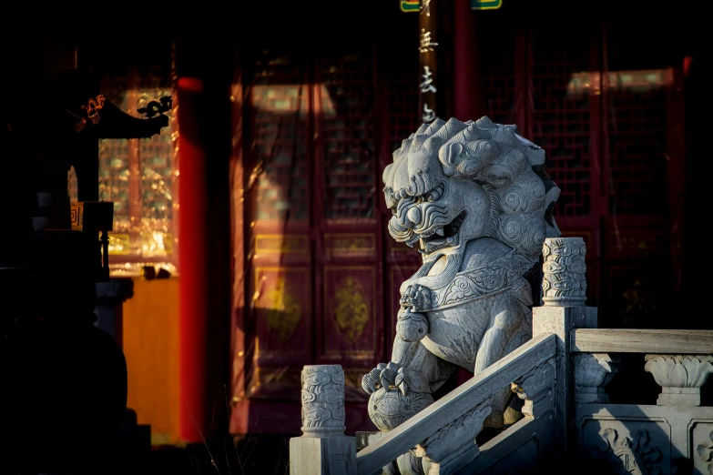 a large stone lion statue in a public setting