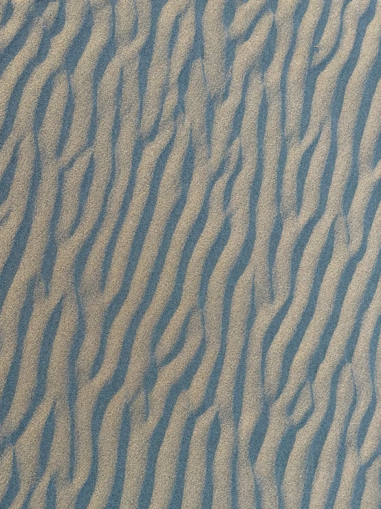 the texture of a sand dune is painted blue