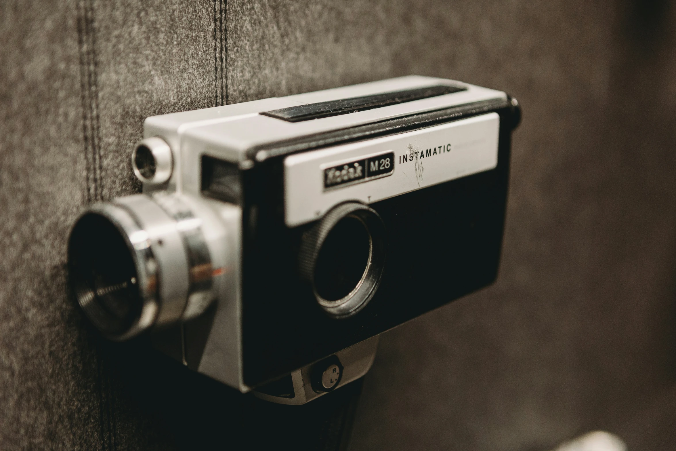 a camera mounted to a wall in a public room