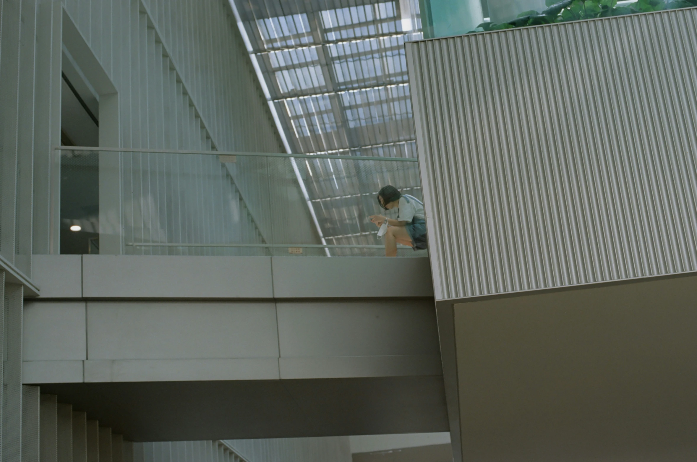 a man on an escalator in the middle of a building