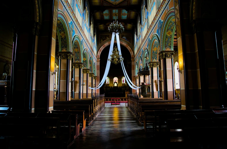 a long church has blue lights and chairs