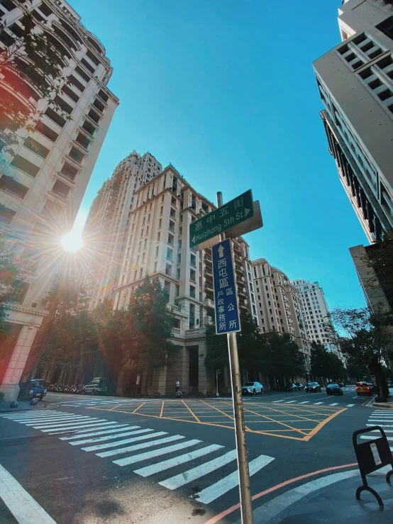 a street view looking up at tall buildings