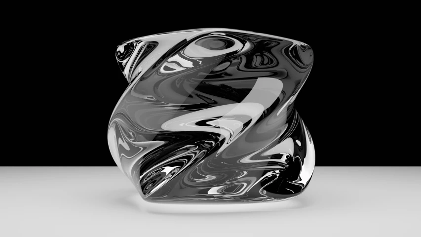 a glass sculpture sits in the dark with a black background