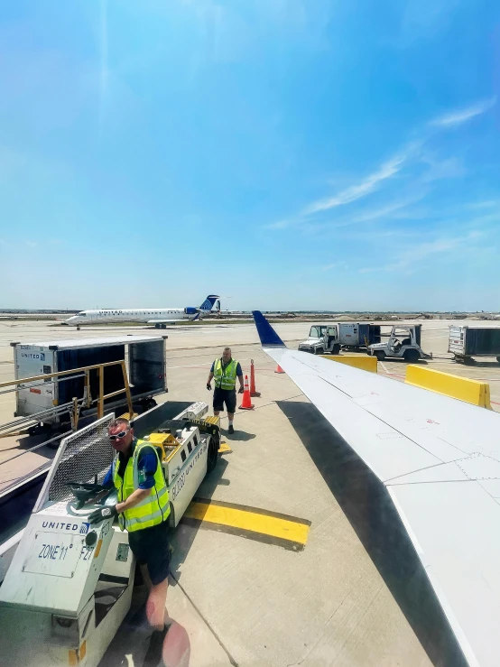 a plane sitting at an airport loading passengers