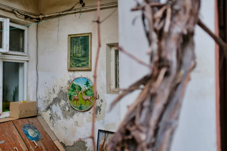 a room that has been badly repaired with paint and debris on the floor