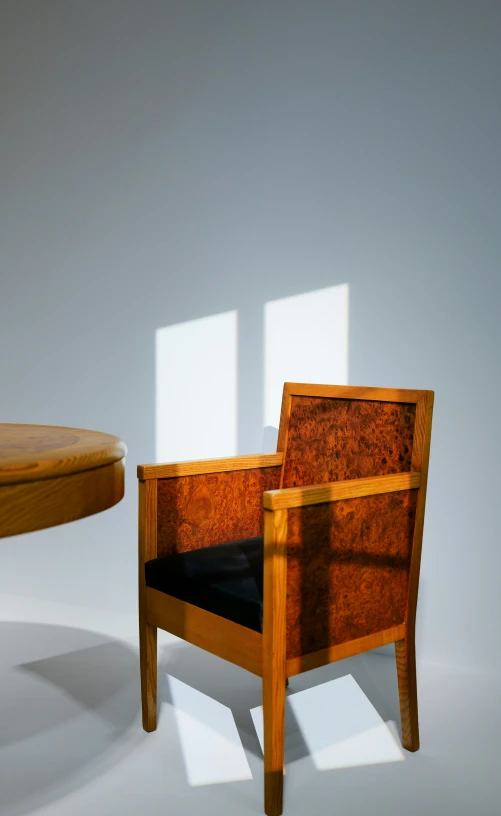 a wooden chair in the middle of a room