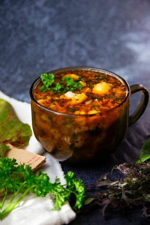 a large bowl filled with food sitting next to a green leafy plant