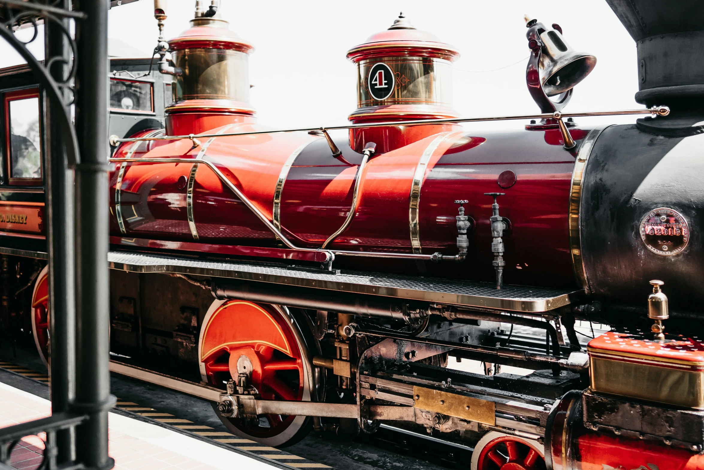 a train on the tracks and a man standing next to it