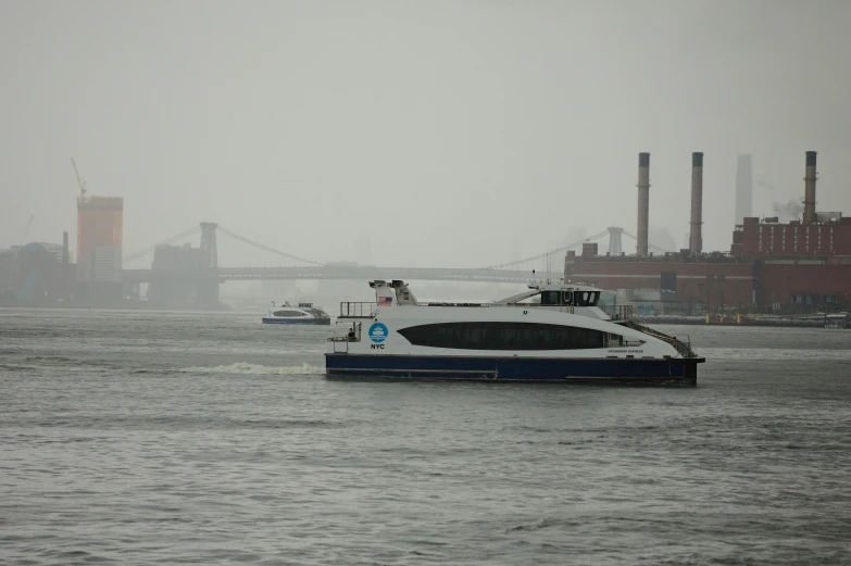 a large boat on a river near a large building