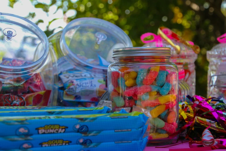 there is candy next to a blue box