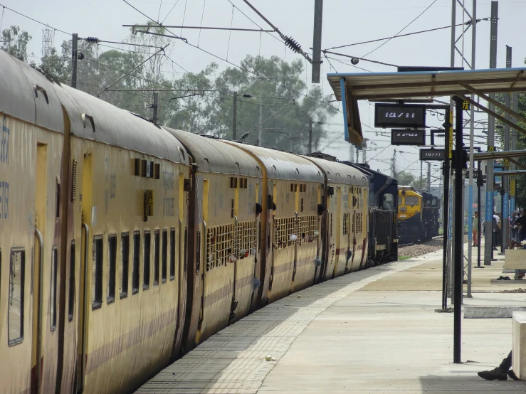 a train is seen coming down a track and it's red or yellow