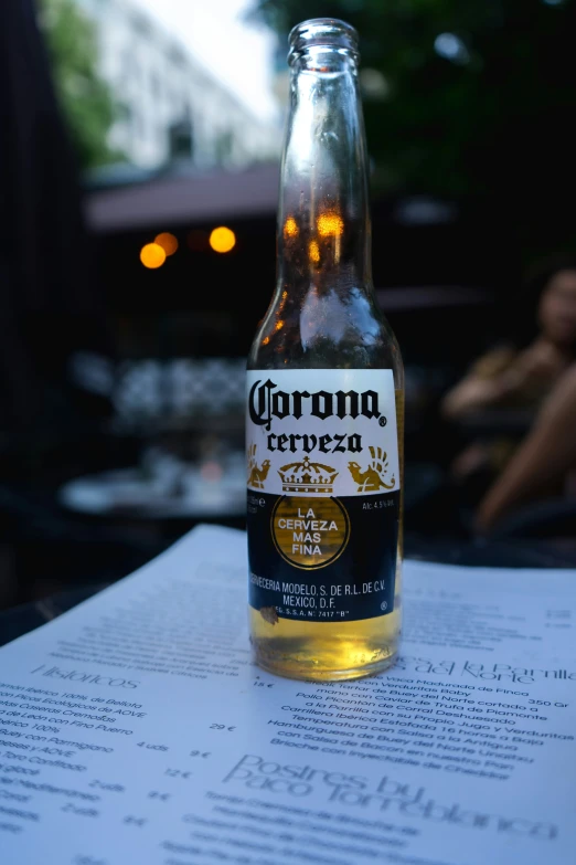 an image of beer in the bottle sitting on a table