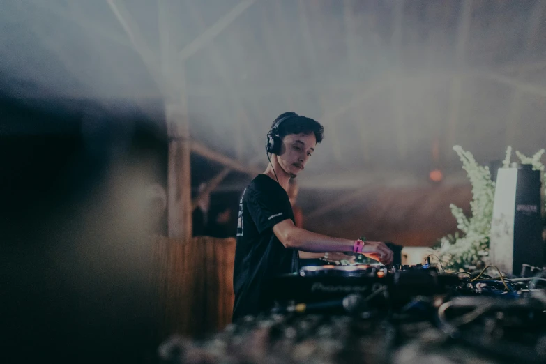 a dj playing some music at his record booth