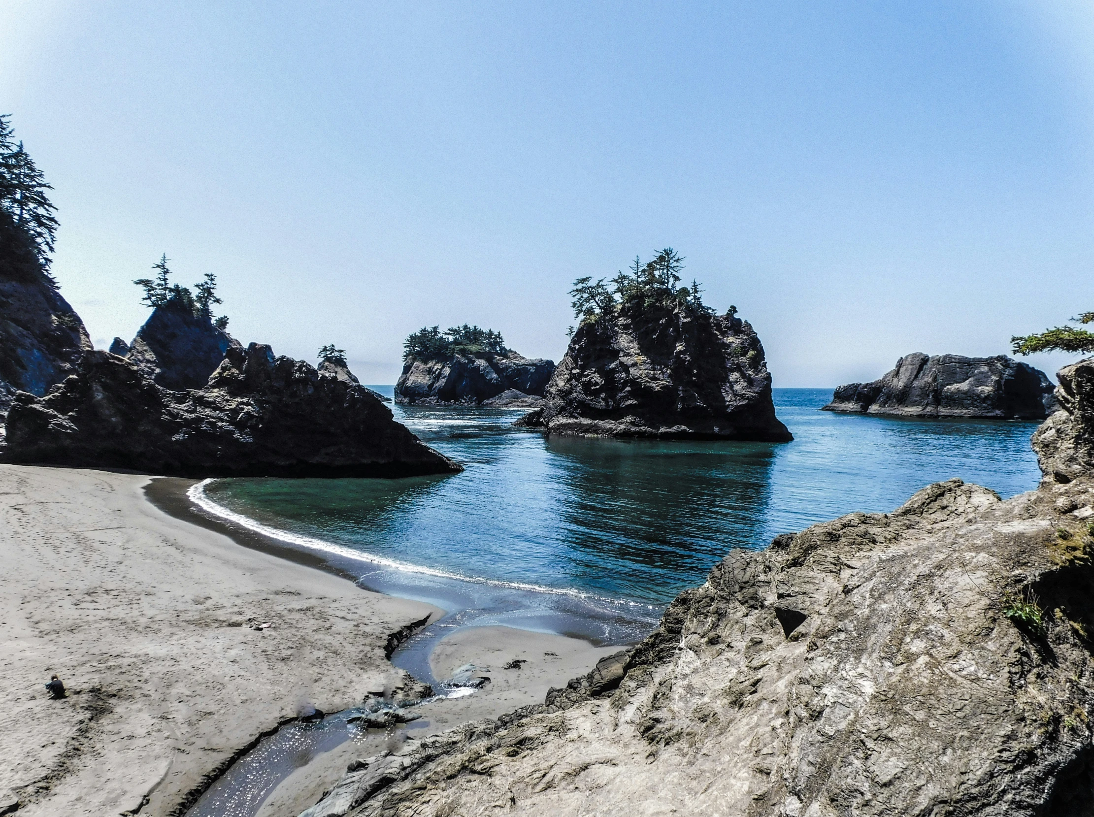 a large body of water surrounded by rocky outcropping