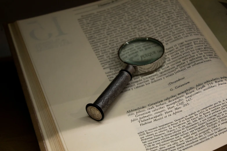 a magnifying glass on top of a book