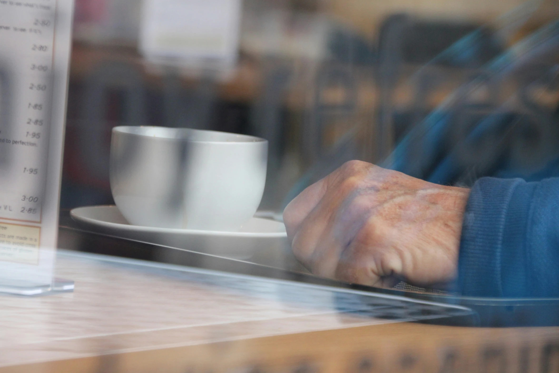 there is a person sitting at a table and using a laptop