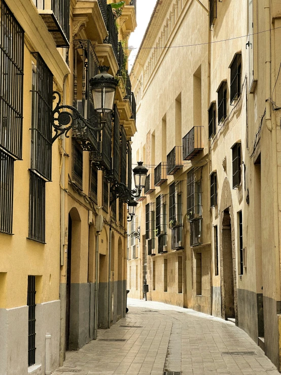 empty cobblestone street with small balconies