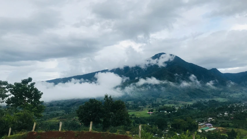 the mountains are covered in low cloud cover