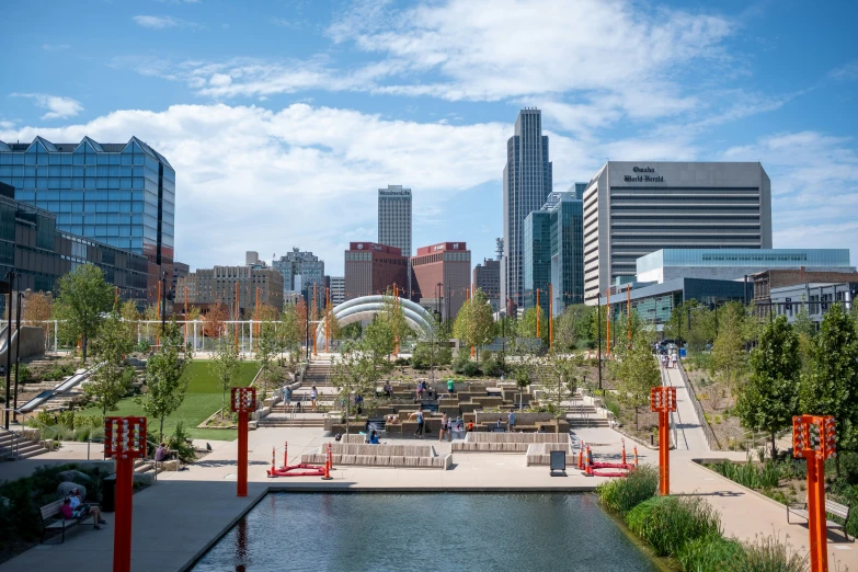 an urban landscape with park benches, water, and buildings