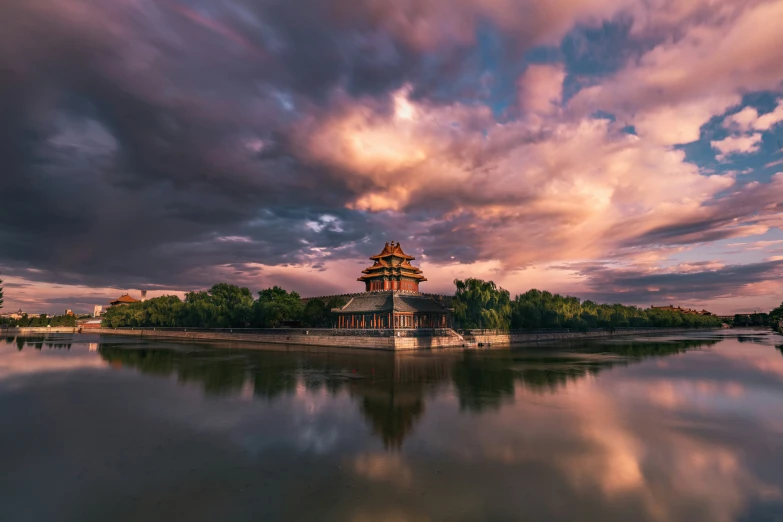 a beautiful evening at a chinese temple on a river