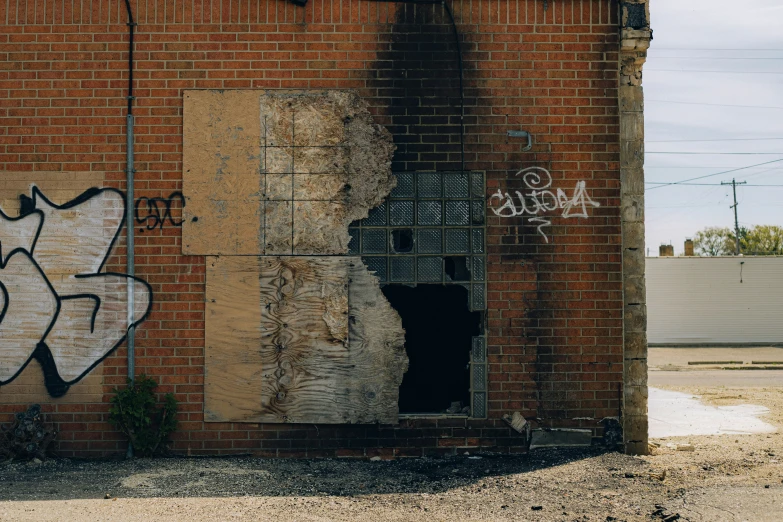 an abandoned building has a bunch of grafitti and graffiti on it