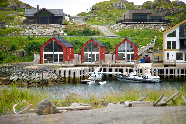 there are a number of small buildings in the water