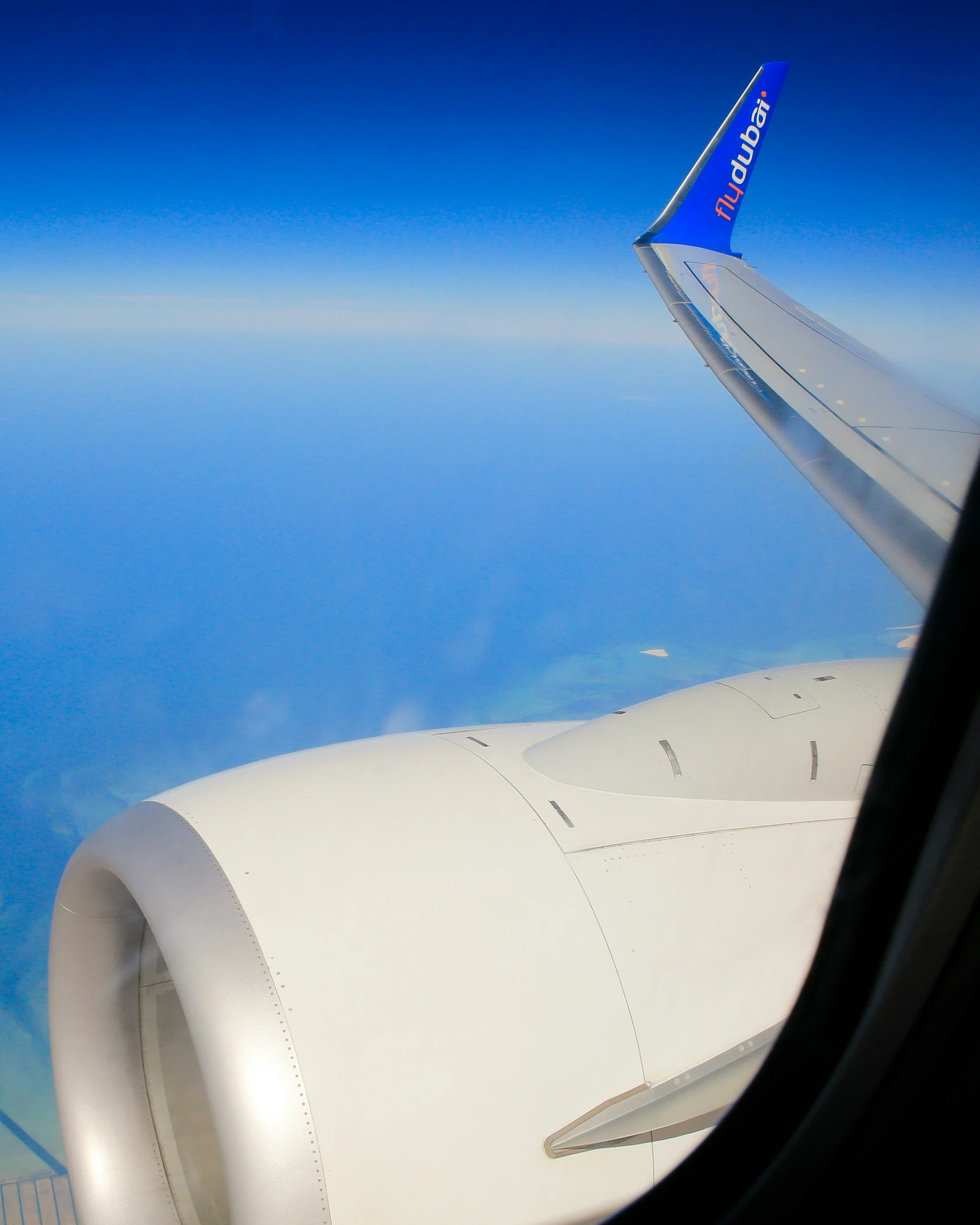 an airplane wing, flying through the air