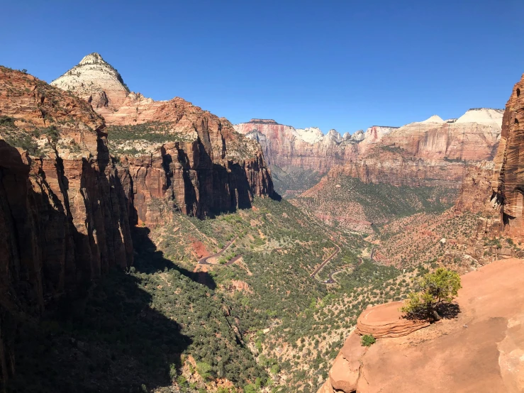 many layers of rock in the mountains near trees