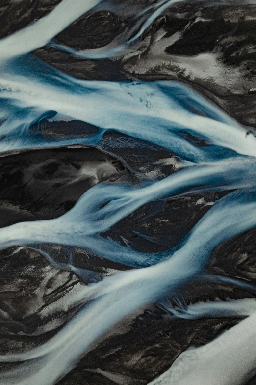 an abstract image of a river flowing over land