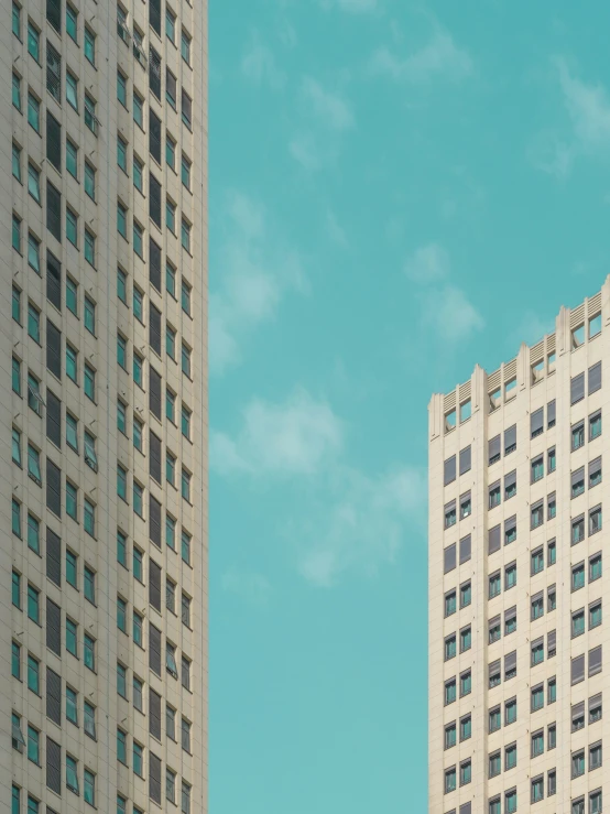 the tall white buildings are two in the foreground