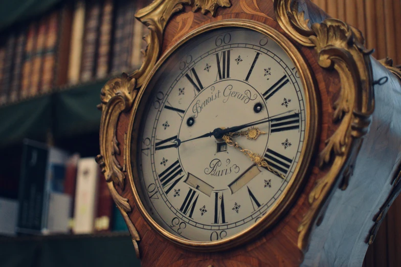 a clock that is sitting on the shelf