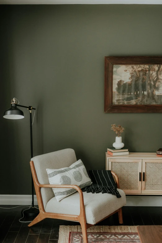 a white chair in a corner of a living room