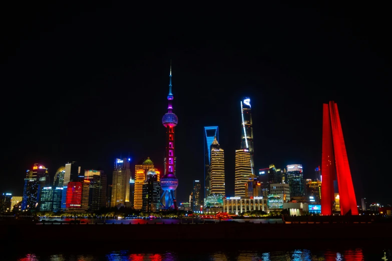 bright lights illuminate skyscrs with modern buildings in the background