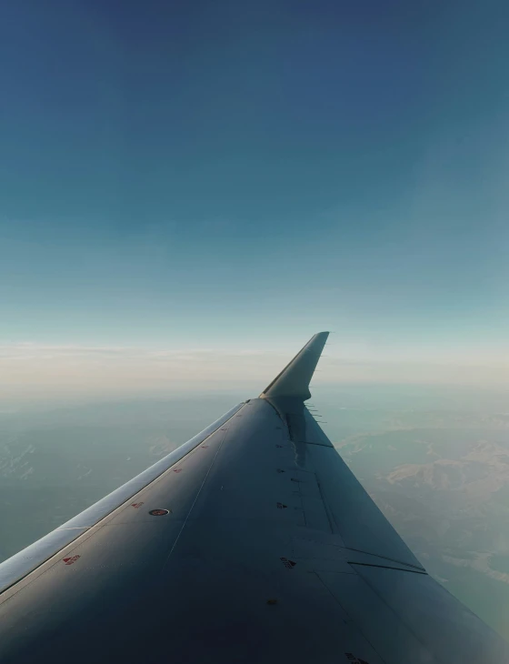 a view of the wing from inside an airplane