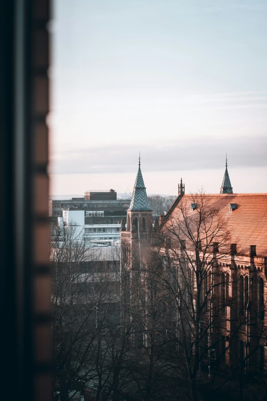 a po taken outside a window of some buildings