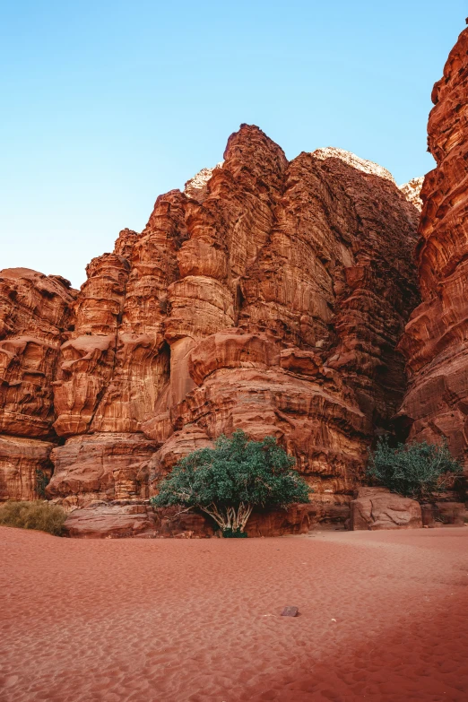 a rocky mountain range is seen with a desert like area