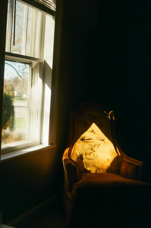 a chair with a pillow sits in the corner of the room