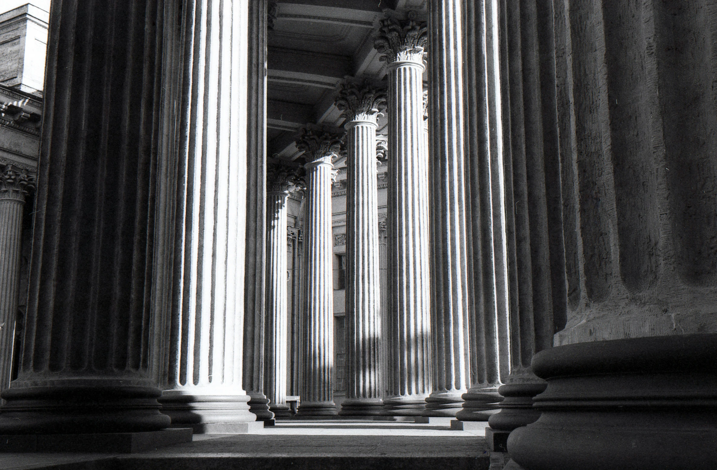 a black and white pograph of columns and arches