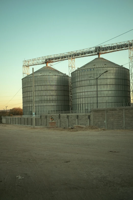 two large silos sitting next to each other