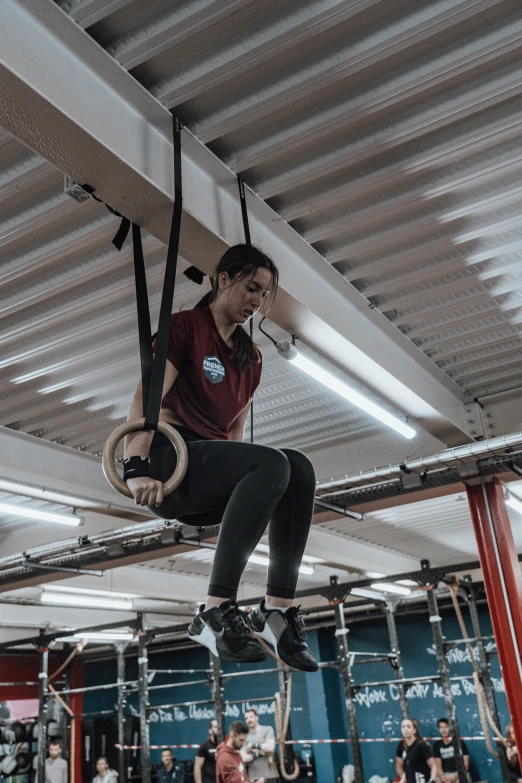 a man is suspended on a rope over ropes