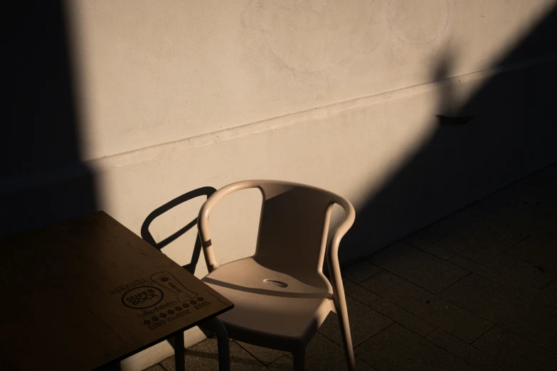 a brown table some chairs and a light