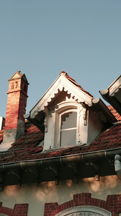 a picture of a clock on the roof of a building