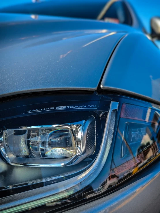 a car close up with shiny headlight and rear bumper