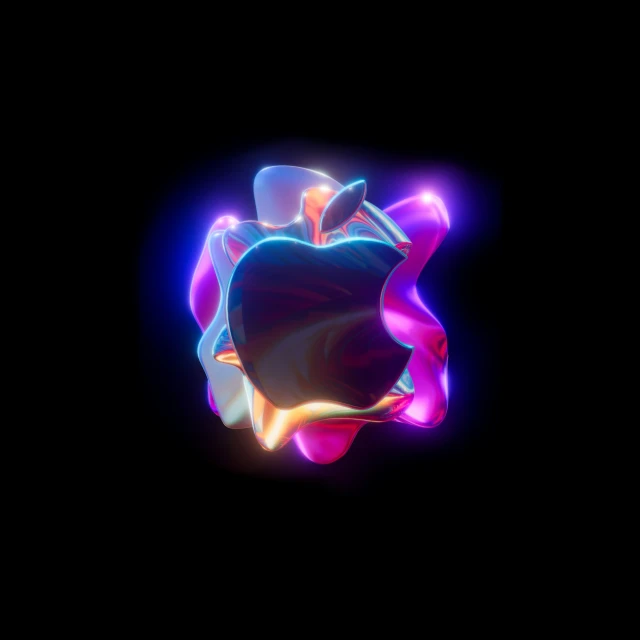 an apple product is seen on a dark background