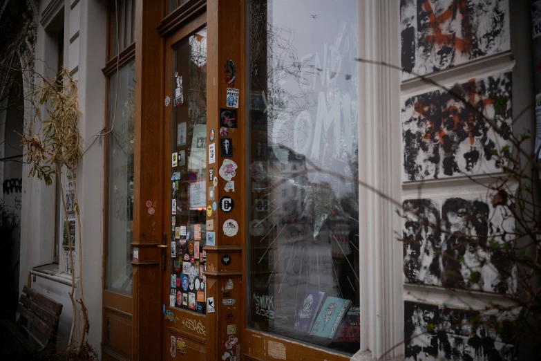 a doorway to a building with posters on it