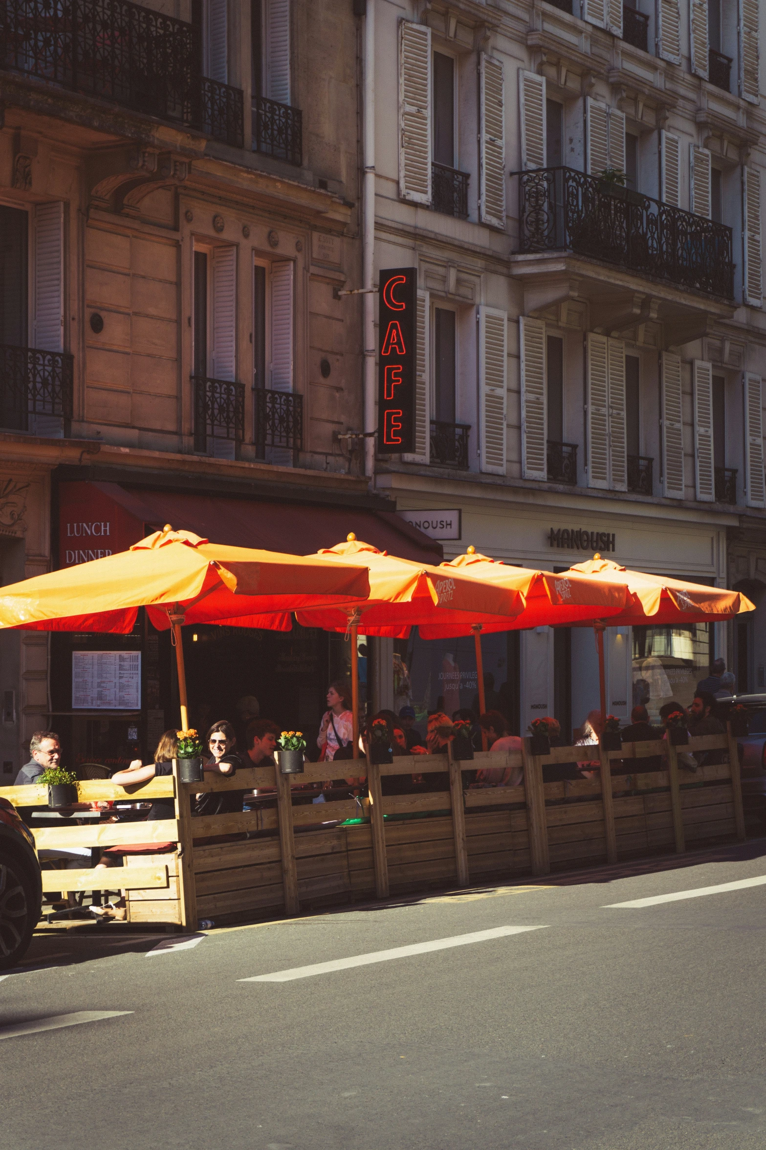 three umbrellas that are next to some buildings