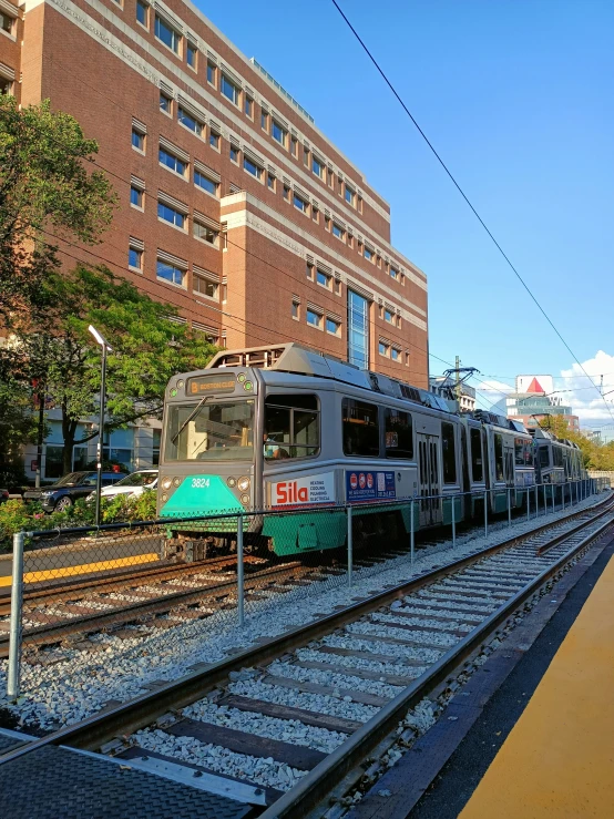 an elevated rail line train traveling down a track