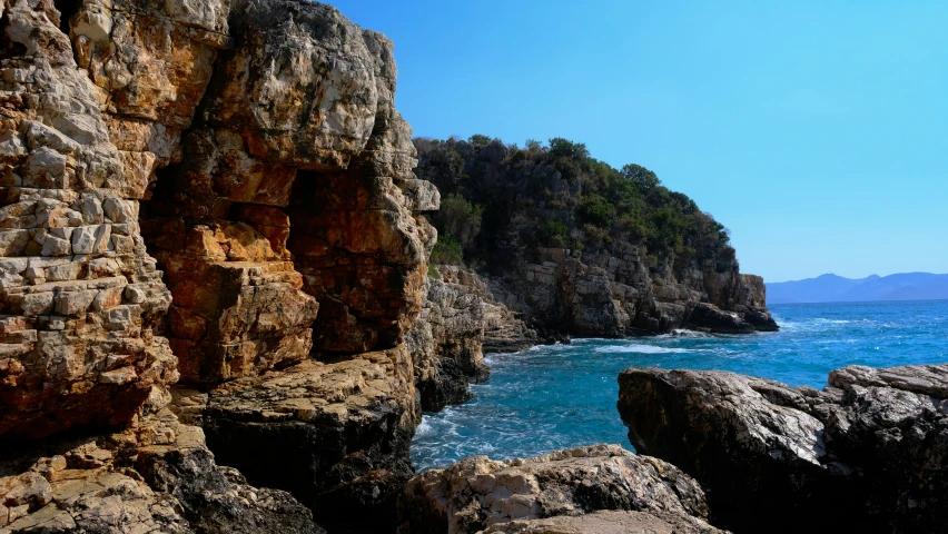 an image of rocky beach scene from a boat